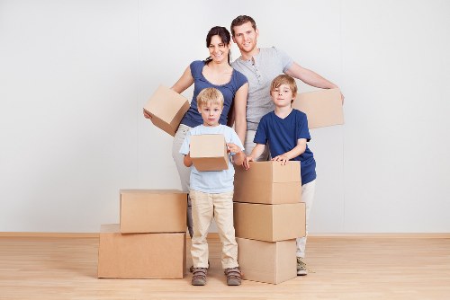 Team organising boxes and furniture for combined moving and storage