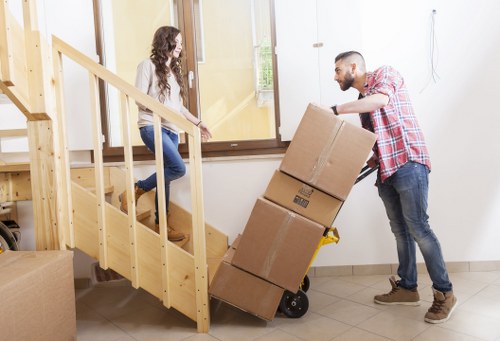 Fragile household items being carefully packed in Tottenham