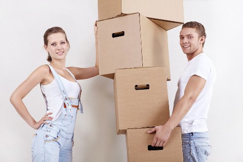 Careful loading of boxes into a small removals van