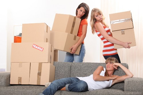 Moving day preparation with labelled boxes and furniture in a Tottenham home